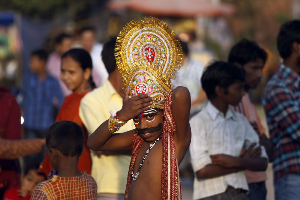 An Indian boy dressed as mythological demon king Ravana adjusts his headgear as he takes part in Dussehra festival celebrations in Amritsar, India, 24 October 2012. Dussehra is an annual Hindu religious festival which follows the nine-day festival of Navratri and is celebrated as the victory of the mytholigical Hindu God Lord Rama over the evil demon king Ravana.