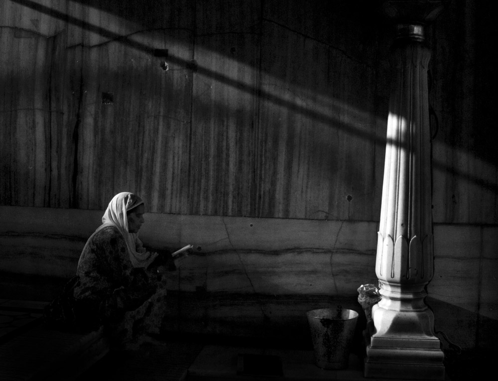 Woman prays morning time Golden Temple Amritsar