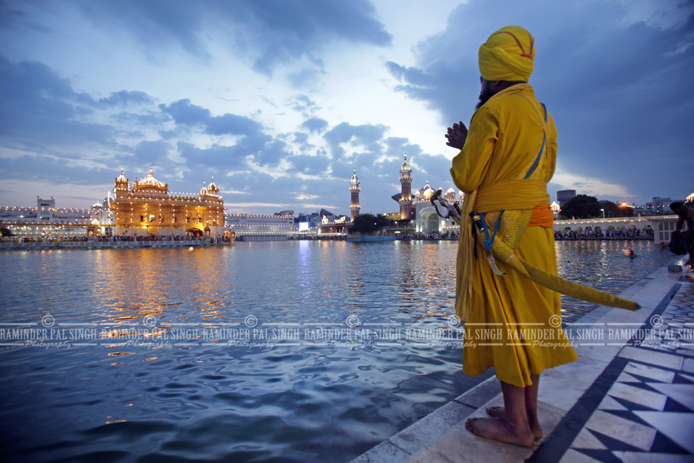 Baptized Sikh man prays at Golden Temple Amritsar