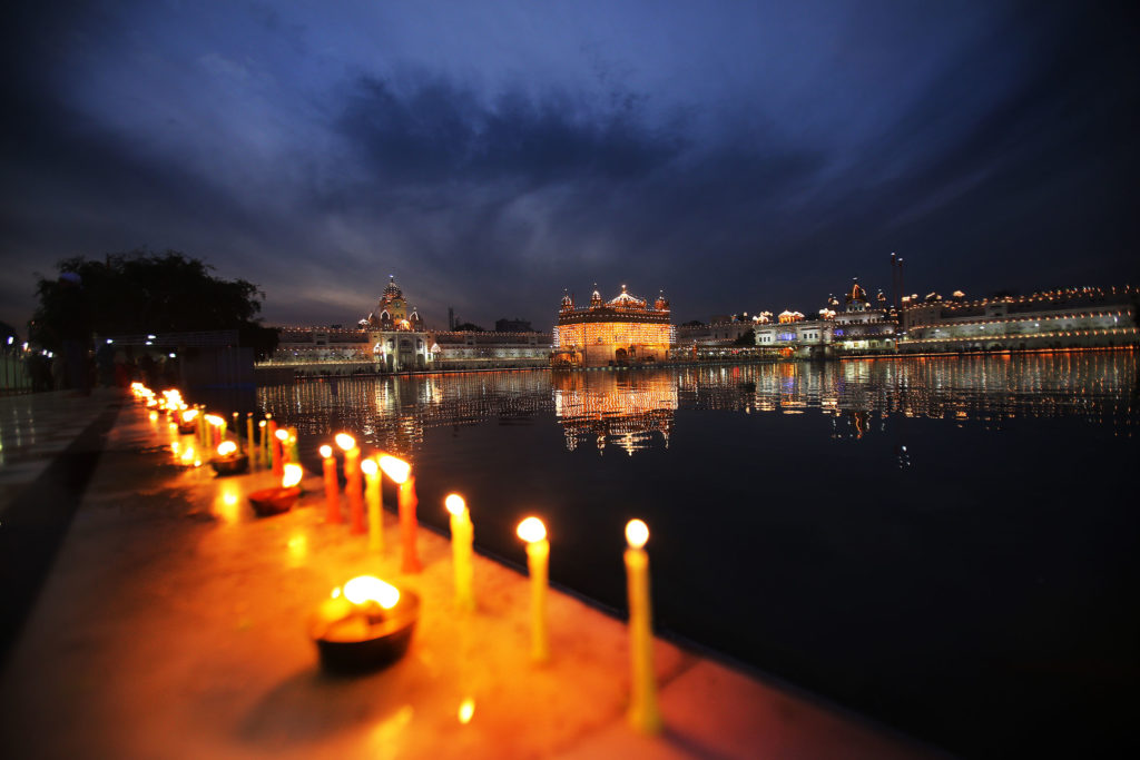 Candles lamps near holy pond Sarowar at Golden Temple Amritsar