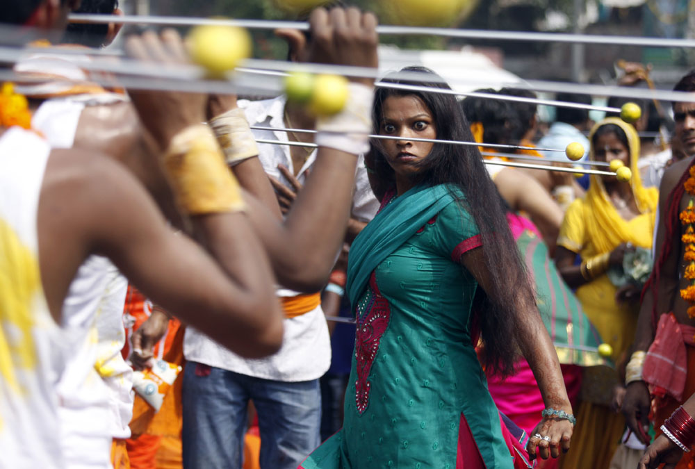 Woman goes into trance state during a religious procession