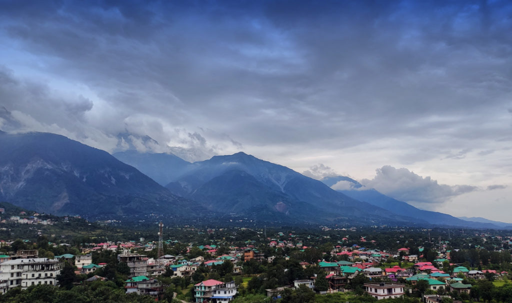 CLouds form above hills with a view of lower Dharamsala Dharamshala