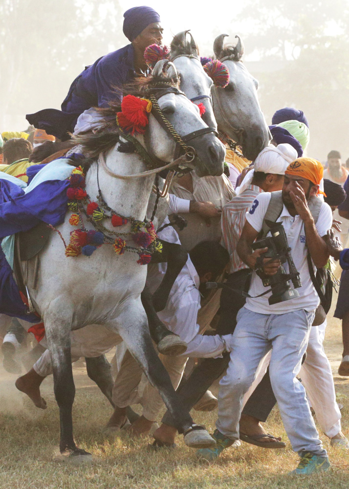 Tent-pegging horses collide with spectators