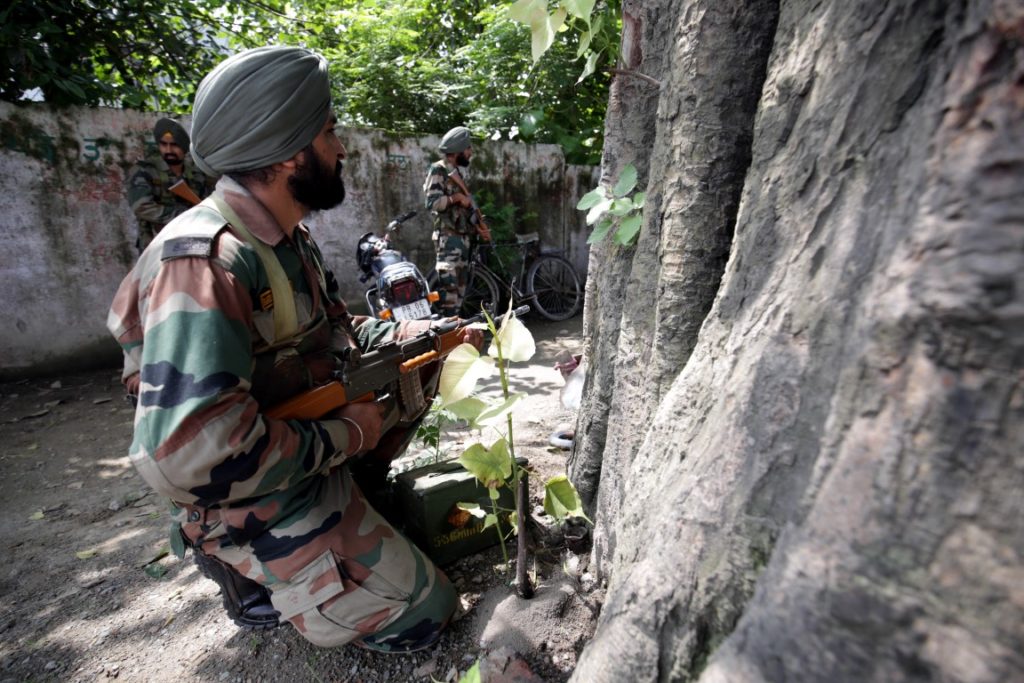 Indian Army soldiers take position as encounter continues with militants holed up in the police station at Dinanagar in Gurdaspur, India, 27 July 2015.